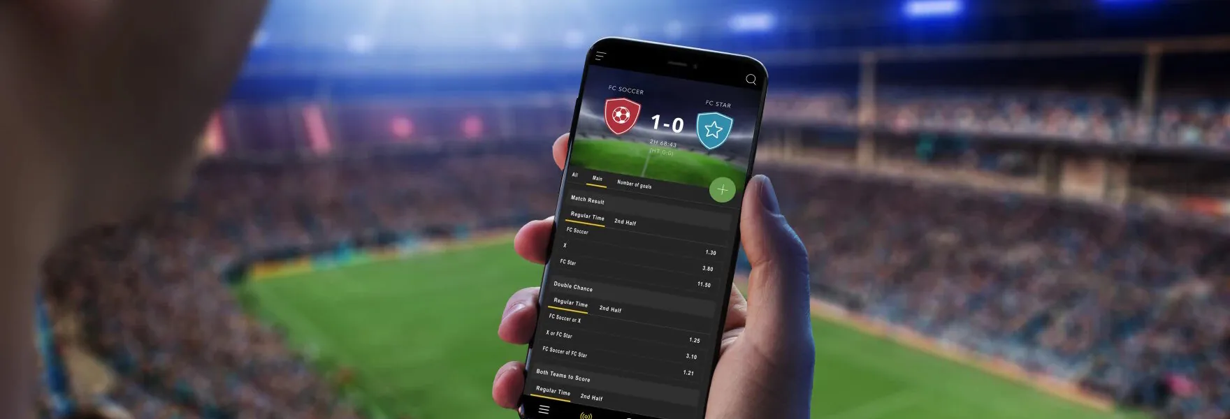 a man is betting on his cell phone